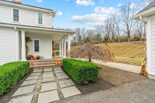 view of yard featuring covered porch