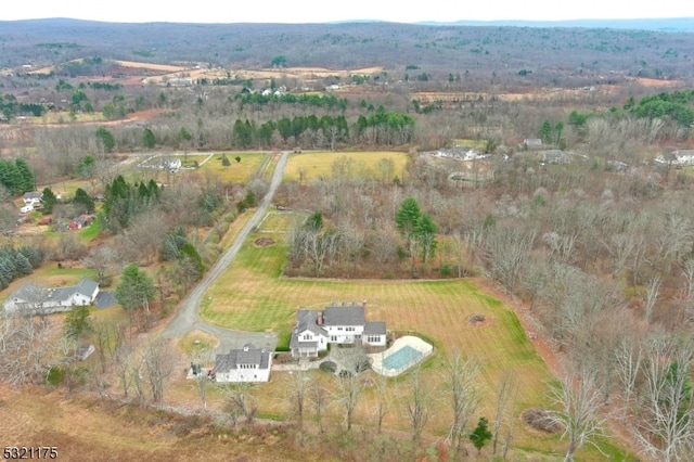 birds eye view of property featuring a rural view