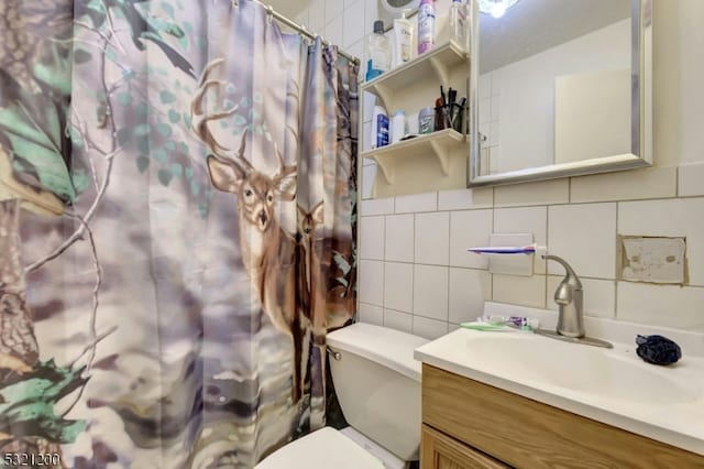 bathroom featuring decorative backsplash, a shower with shower curtain, vanity, tile walls, and toilet