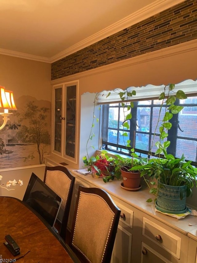 dining area with crown molding