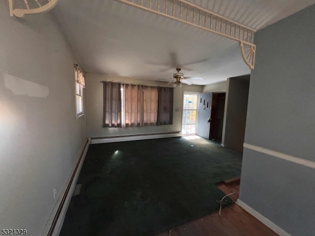 interior space featuring ceiling fan and baseboard heating