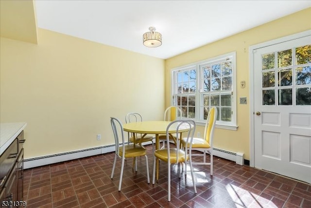 dining area with a baseboard radiator