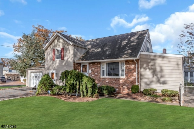 view of front facade with a front lawn and a garage