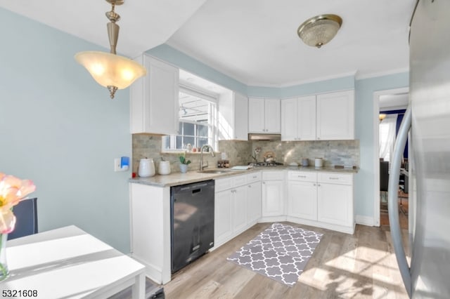 kitchen featuring black dishwasher, white cabinetry, light hardwood / wood-style flooring, and tasteful backsplash