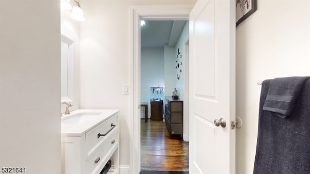 bathroom featuring vanity and wood-type flooring