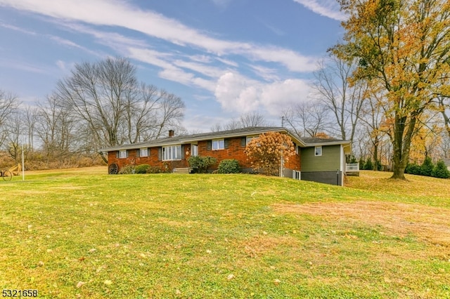 ranch-style home featuring a front yard