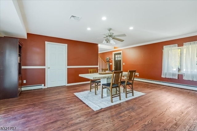 dining area with baseboard heating, ornamental molding, hardwood / wood-style flooring, and ceiling fan