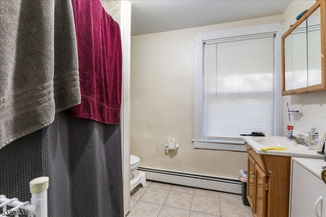 bathroom with vanity, a baseboard radiator, toilet, and tile patterned flooring