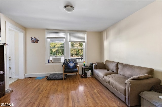 living room featuring cooling unit and wood-type flooring