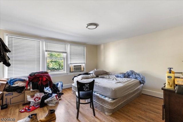 bedroom featuring wood-type flooring