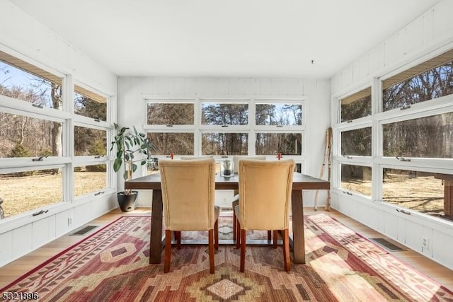 sunroom / solarium with a healthy amount of sunlight and visible vents