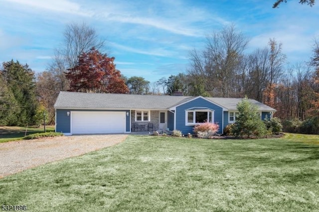 ranch-style house with stone siding, a chimney, gravel driveway, an attached garage, and a front yard