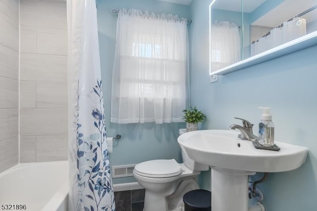 bathroom with visible vents, toilet, and shower / bathtub combination with curtain