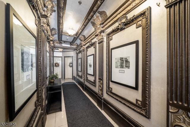 corridor featuring light tile patterned floors and ornamental molding