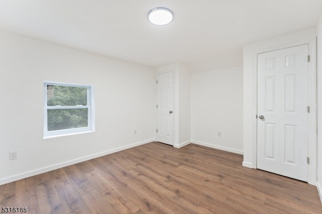 spare room featuring hardwood / wood-style flooring