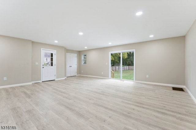 unfurnished living room with light wood-type flooring