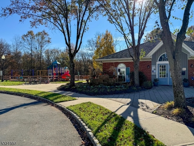 view of front of house featuring a playground