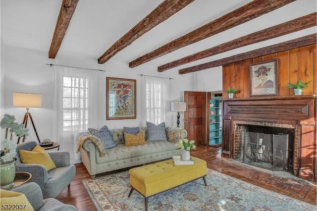 living room with beamed ceiling, a fireplace, and dark hardwood / wood-style flooring