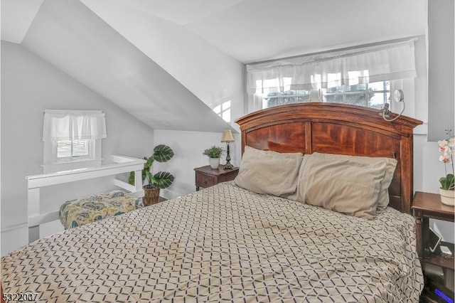 bedroom with lofted ceiling