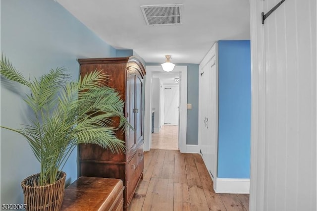 hallway with light wood-type flooring