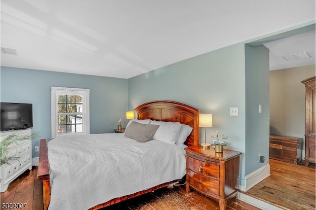 bedroom featuring dark wood-type flooring