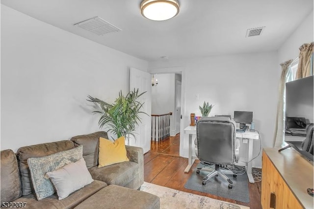 office space with wood-type flooring