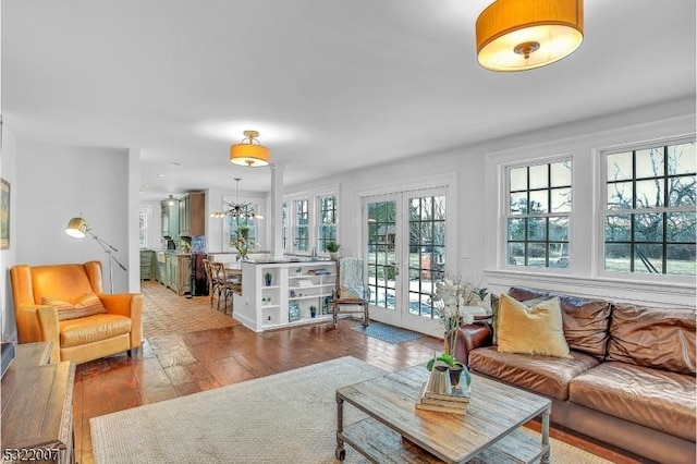 living room with hardwood / wood-style floors and french doors