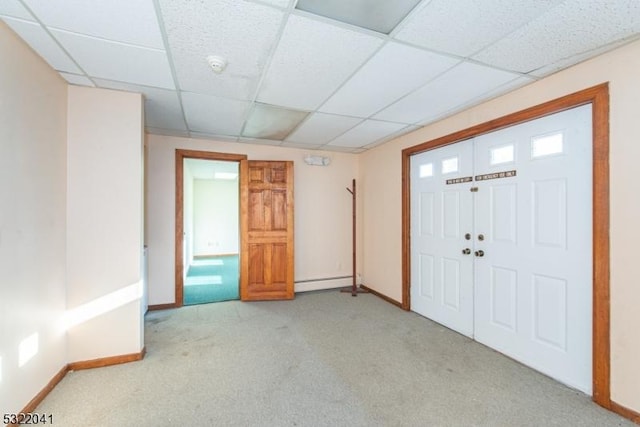 74 S Powder Mill Rd, Parsippany-Troy Hills Twp, NJ 07950 - carpeted foyer featuring a baseboard heating unit, baseboards, and a paneled ceiling
