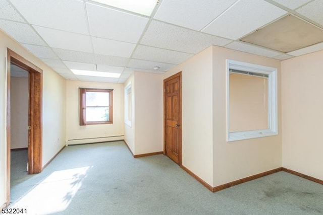 74 S Powder Mill Rd, Parsippany-Troy Hills Twp, NJ 07950 - spare room with a baseboard radiator, a paneled ceiling, light carpet, and baseboards