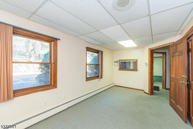 74 S Powder Mill Rd, Parsippany-Troy Hills Twp, NJ 07950 - spare room with a baseboard heating unit, a paneled ceiling, carpet flooring, and baseboards