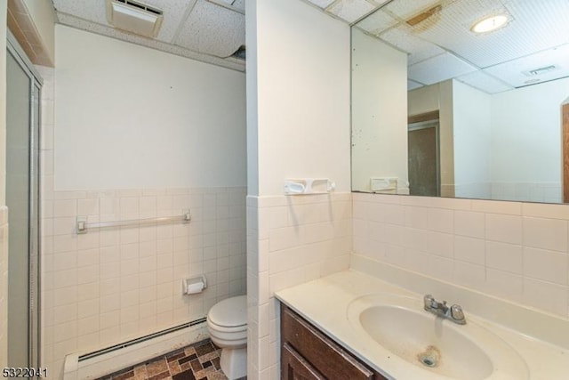74 S Powder Mill Rd, Parsippany-Troy Hills Twp, NJ 07950 - full bath with a baseboard radiator, tile walls, a shower stall, toilet, and vanity