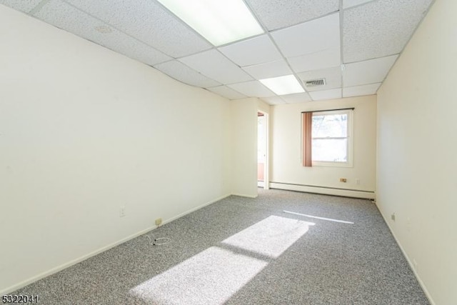 74 S Powder Mill Rd, Parsippany-Troy Hills Twp, NJ 07950 - spare room with baseboard heating, a paneled ceiling, carpet flooring, and baseboards