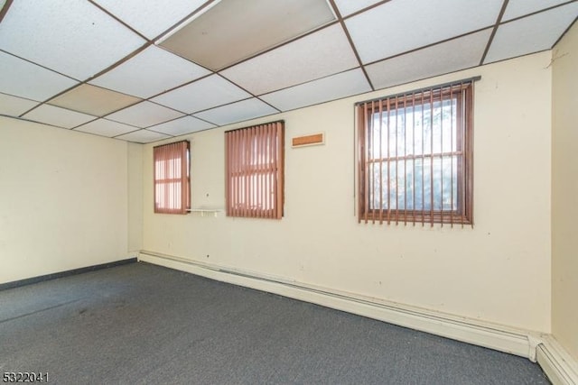 74 S Powder Mill Rd, Parsippany-Troy Hills Twp, NJ 07950 - spare room with baseboard heating, a paneled ceiling, healthy amount of natural light, dark carpet, and baseboards
