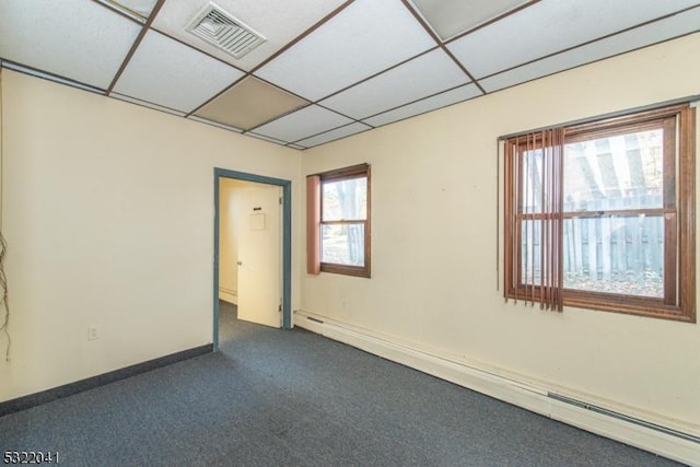 74 S Powder Mill Rd, Parsippany-Troy Hills Twp, NJ 07950 - unfurnished room featuring a baseboard heating unit, a drop ceiling, dark carpet, and baseboards