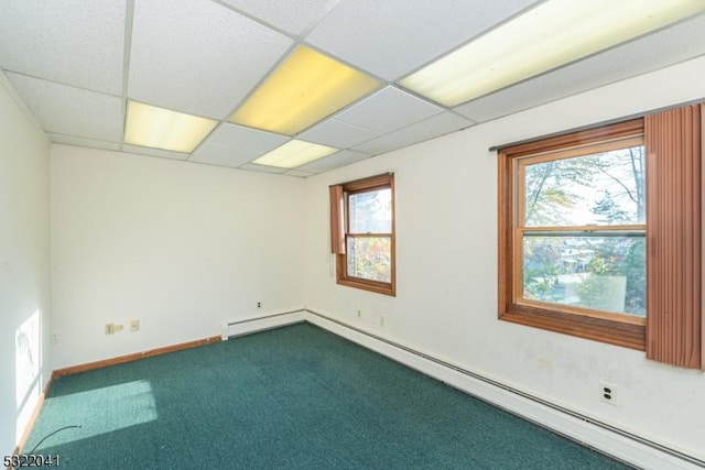 74 S Powder Mill Rd, Parsippany-Troy Hills Twp, NJ 07950 - spare room with a baseboard heating unit, dark carpet, a drop ceiling, healthy amount of natural light, and baseboards