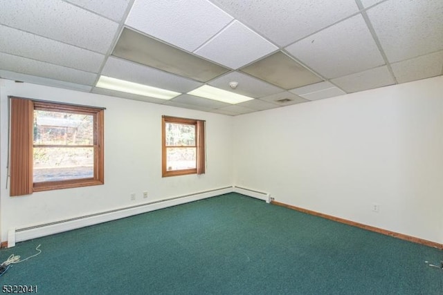 74 S Powder Mill Rd, Parsippany-Troy Hills Twp, NJ 07950 - unfurnished room with dark colored carpet, baseboard heating, a paneled ceiling, and baseboards