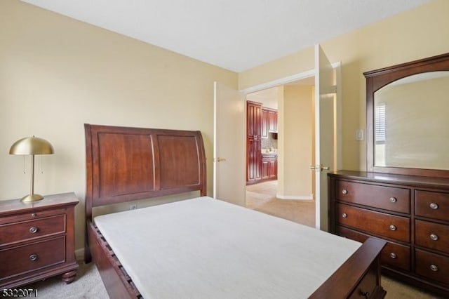 bedroom featuring light colored carpet