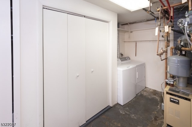 clothes washing area with washer and dryer