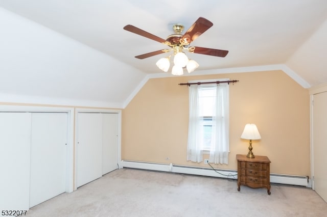 bonus room featuring lofted ceiling, light carpet, ceiling fan, and a baseboard radiator