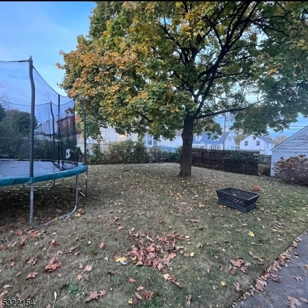 view of yard with a trampoline