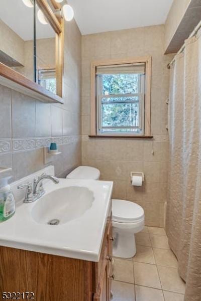 110 Central, Rochelle Park Twp, NJ 07662 - bathroom featuring tile walls, vanity, toilet, tile patterned floors, and curtained shower