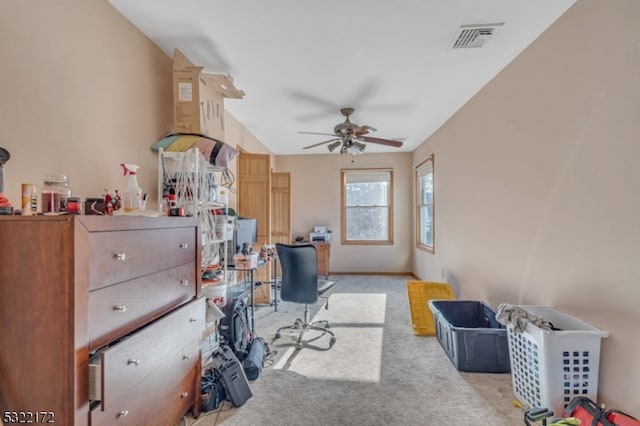 carpeted office featuring ceiling fan