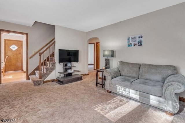 110 Central, Rochelle Park Twp, NJ 07662 - living room featuring arched walkways, stairway, and carpet floors