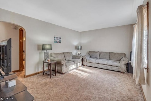 110 Central, Rochelle Park Twp, NJ 07662 - living area with arched walkways, light colored carpet, and baseboards