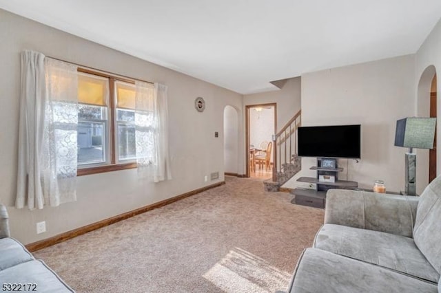 110 Central, Rochelle Park Twp, NJ 07662 - carpeted living room featuring arched walkways, stairway, and baseboards