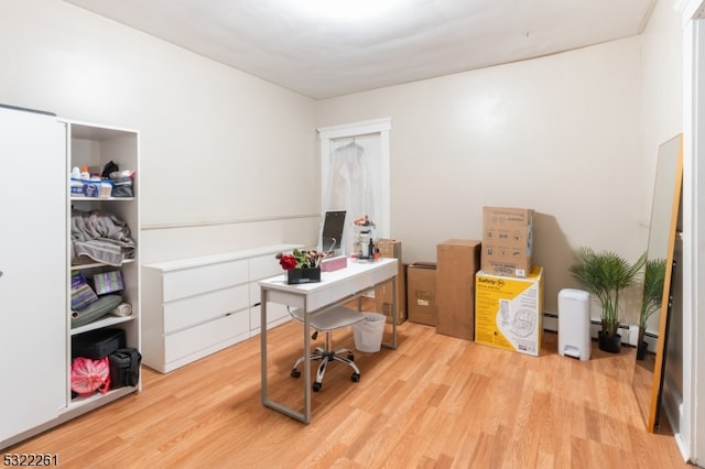 office with light wood-type flooring