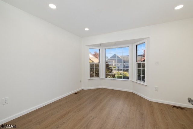 empty room with light wood-type flooring