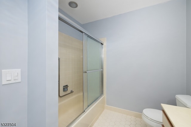 full bathroom with combined bath / shower with glass door, vanity, and toilet