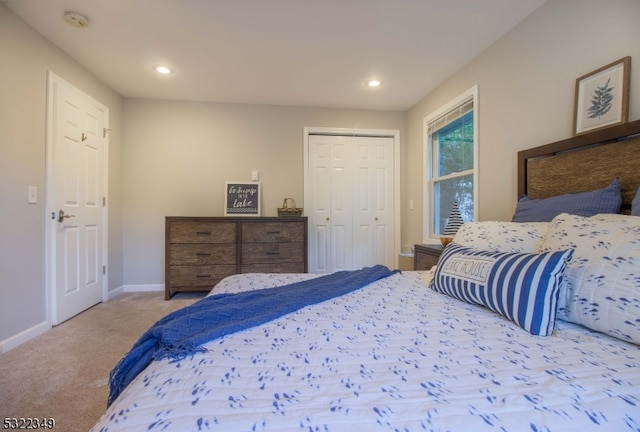 carpeted bedroom with a closet