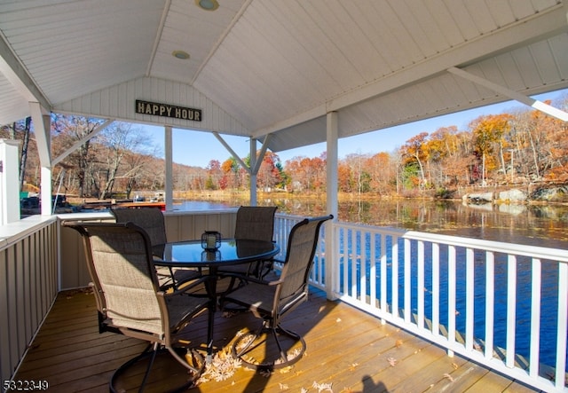 wooden terrace with a water view